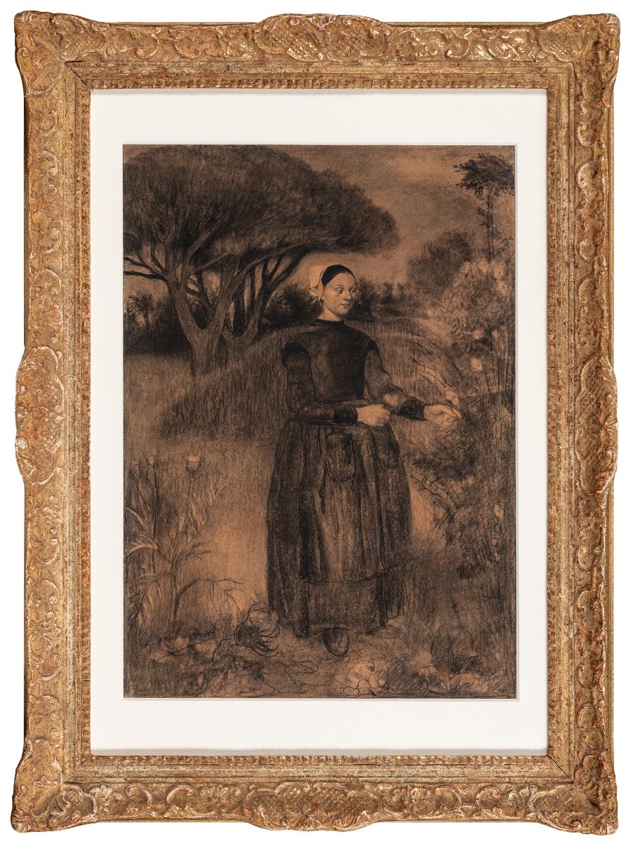 Jeune femme cueillant des fleurs dans un jardin